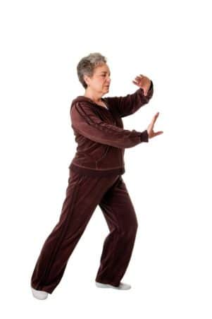 elderly woman doing tai chi