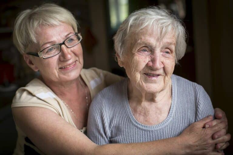 elderly woman with adult daughter