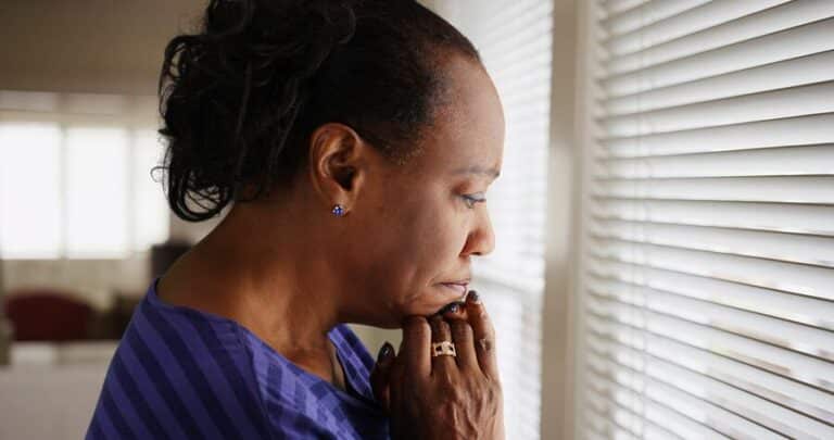 older black woman with worried expression