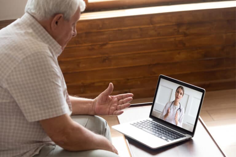 elderly person using computer