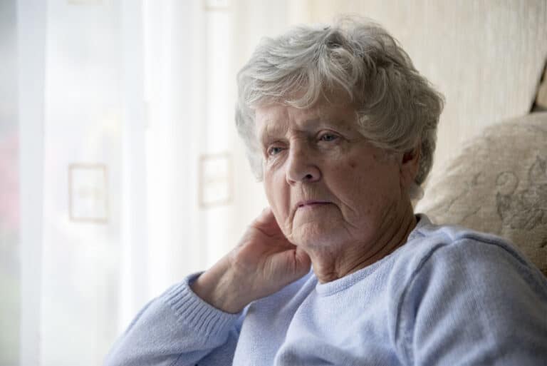 elderly woman with stern expression