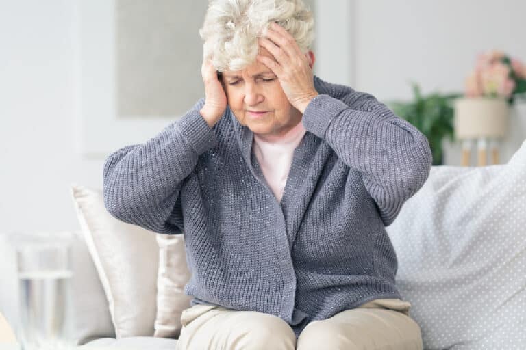 elderly woman with headache