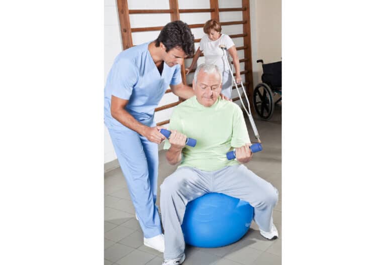 elderly person with physical therapist