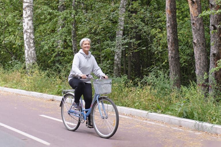 elderly people riding bicycle